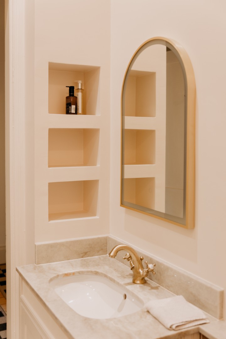 Elegant bathroom with gold fixtures.