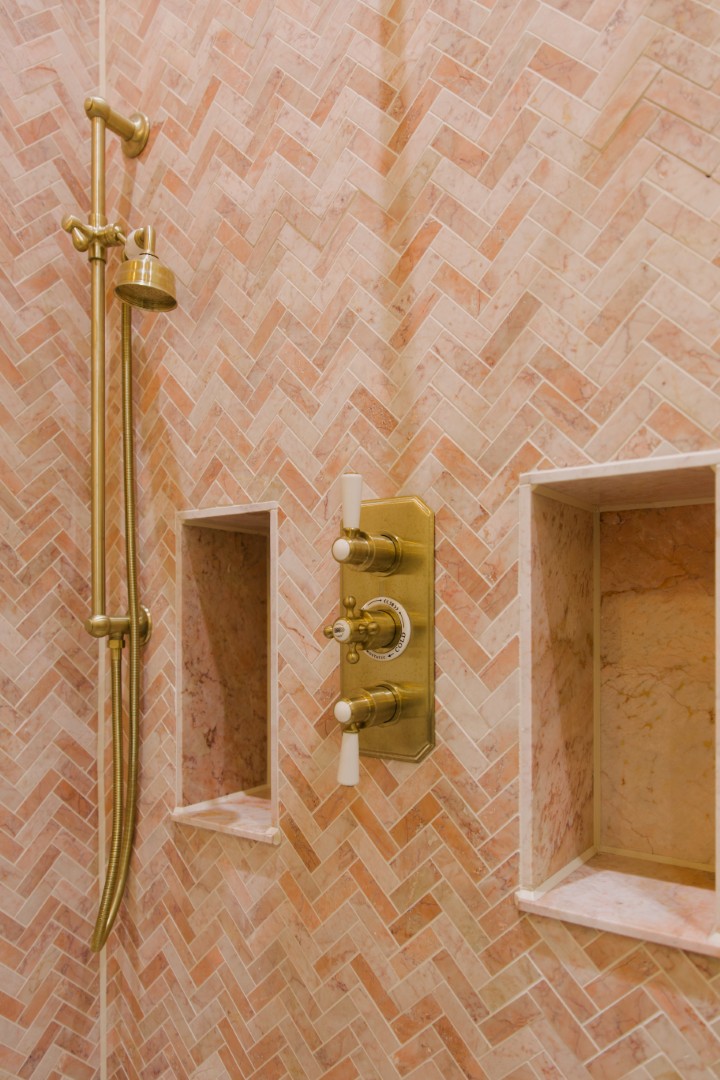 Elegant shower with herringbone tiles.