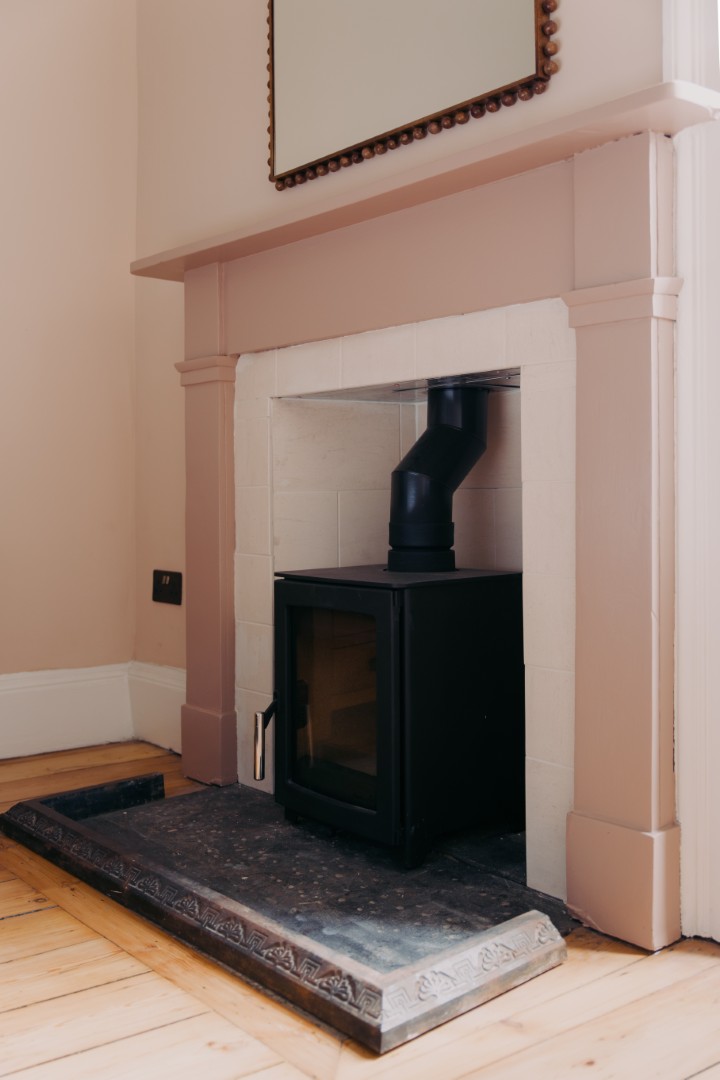 Modern stove in a classic fireplace