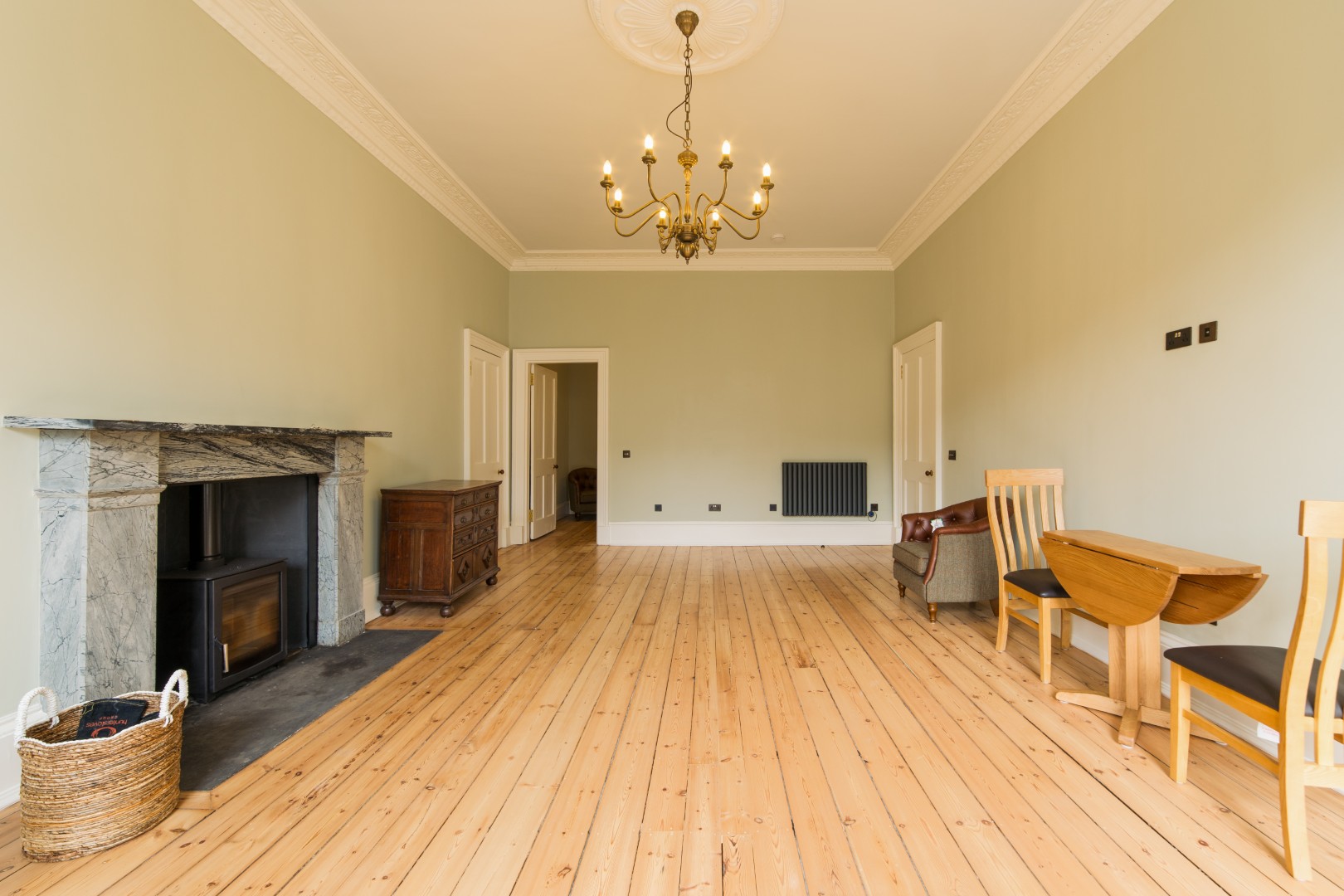 Spacious room with wooden flooring.
