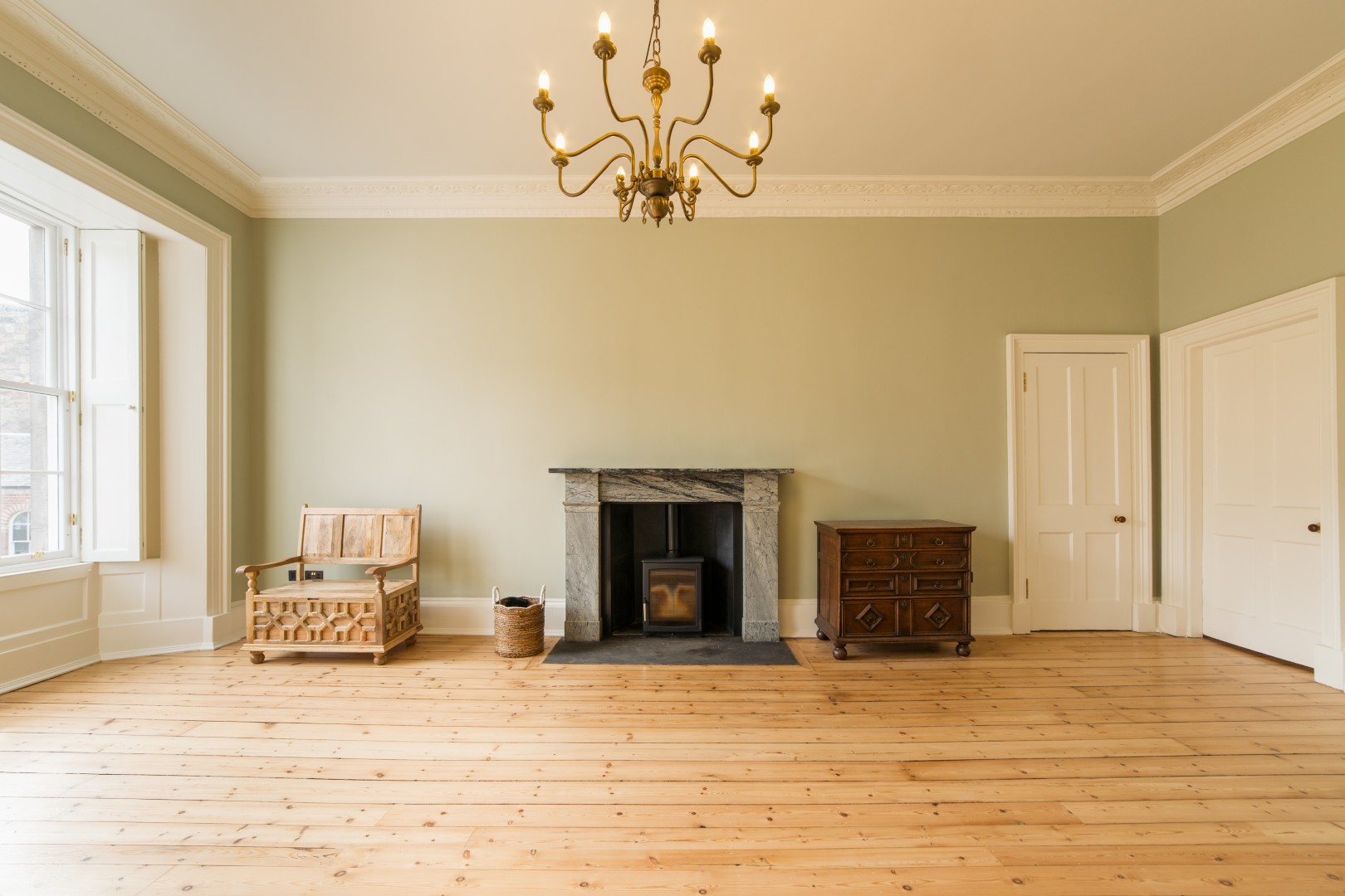 Spacious room with wooden flooring.