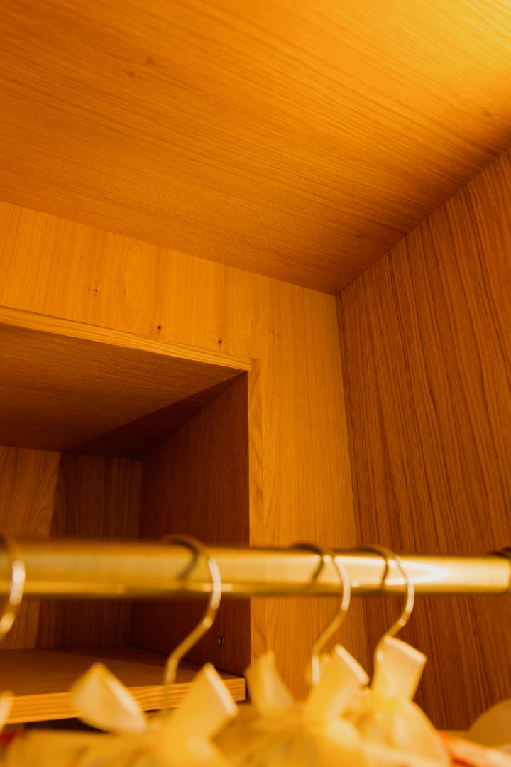 Warm wooden interior of a wardrobe