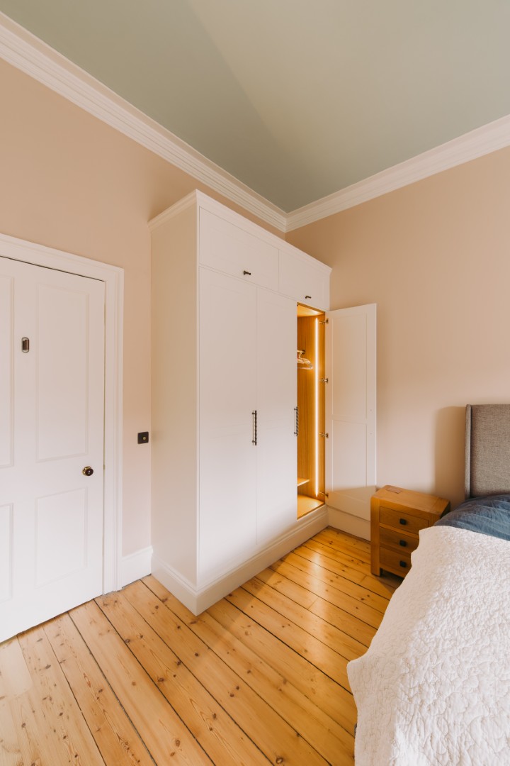Modern bedroom with stylish storage unit.