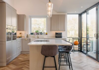 Modern kitchen with stylish wooden flooring.